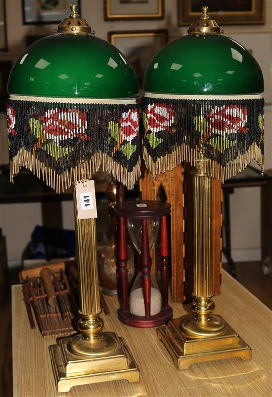 A pair of Corinthian column table lamps with beaded shades